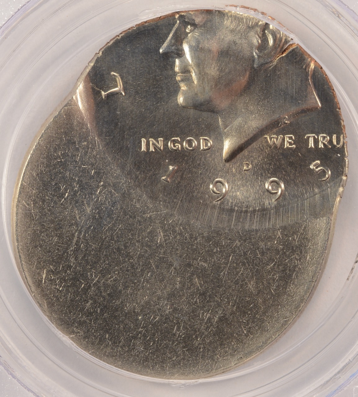 1995 Kennedy half dollar off-center strike showing blank crescent and shifted portrait
