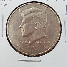 1995 Kennedy half dollar filled die error showing missing or incomplete letters in LIBERTY